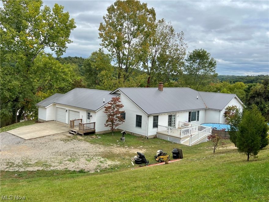 This beautiful home sits on top of the hill, overlooking a gorgeous view of the land, with a peaceful country setting in the highly desired Tri-Valley LSD. Included are 2 acres to enjoy outside and inside boasts 2608 sq.ft with 4 bedrooms and 2 1/2 baths! The 2 car garage has an additional workshop/storage room. All of the appliances will remain, including the washer & dryer and a trash compactor! You'll love the additional family room that could be a play room, or formal living room! The kitchen has a breakfast nook area, as well as the formal dining room too! Updates include a new metal roof in 2020, furnace & HVAC in 2019 and a new well pump in 2021, to mention a few! There are several heating choices from the propane furnace, wood burning fireplace and the wood burning stove in the lower level. Plenty of space down there to finish to your liking too! The pool table and living room set in the LL will remain! Don't forget to look for the treehouse in the woods! Plenty of deer and wildlife in the area! Call today to schedule your showing!