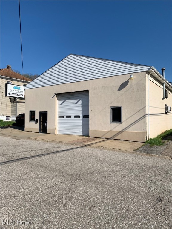 Former All Glass building in downtown Weirton. Two large garage/warehouses (40x40 and 30x40), 3 offices, 1 bathroom, 1 reception area. Each garage has a 12 foot garage door.
