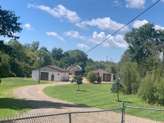 If you need space for your business and/or to build a new house with convenience to freeways and all of Wayne County, here is an opportunity you don't want to miss. This 4.78 Acre offering has large buildings with office, storage and vehicle bays. The large pole building is 40 x 104 with a condition space for storage and office as well as three very large vehicle bays, a full bath with shower and washer dryer hook ups. The front cement block building is 18 x 36 with plenty of storage, one large bays and 480 power. The property also has a 44 x 60 Canvas covered pole barn with a cement foundation and an older 3 sided pole barn for storage. The property is currently the Doylestown Street Garage. This property is currently zoned R1, but the Village will rezone to Commercial Business based on buyer's needs. Offers can be made on this property individually or in conjunction with contiguous 42.1 Acre parcel with frontage on St. Rt. 585. See MLS 5123781 for more details on 42.1 acre offering. All 46.88 Acres are eligible as a Community Reinvestment Area which can provide as much as 100% discount on property taxes for up to 15 years.