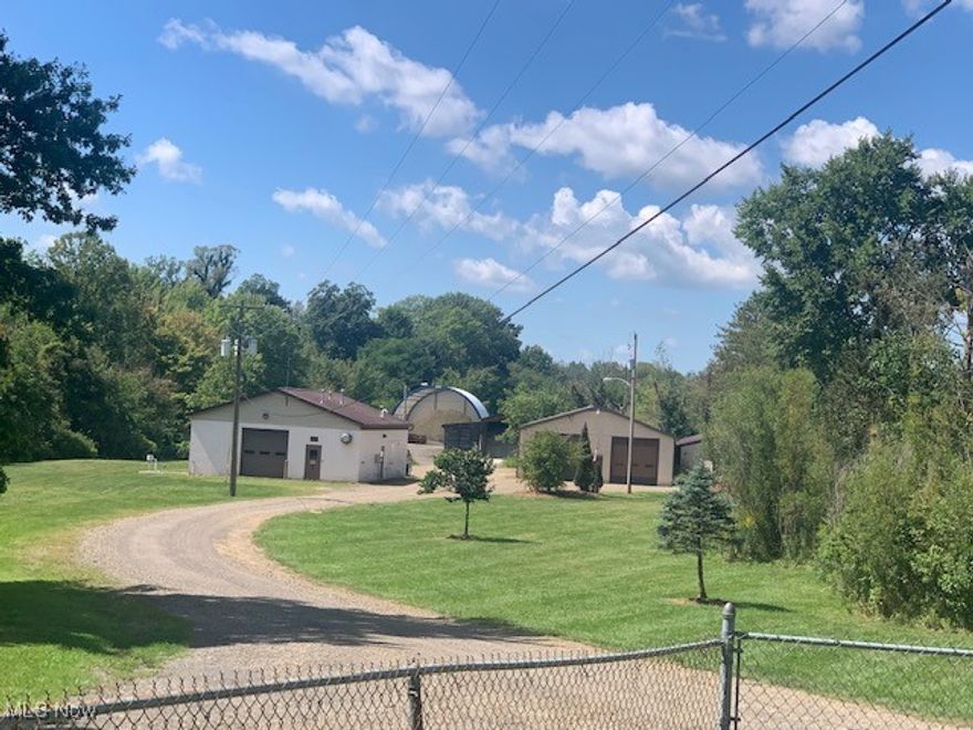 If you need space for your business and/or to build a new house with convenience to freeways and all of Wayne County, here is an opportunity you don't want to miss. This 4.78 Acre offering has large buildings with office, storage and vehicle bays. The large pole building is 40 x 104 with a condition space for storage and office as well as three very large vehicle bays, a full bath with shower and washer dryer hook ups. The front cement block building is 18 x 36 with plenty of storage, one large bays and 480 power. The property also has a 44 x 60 Canvas covered pole barn with a cement foundation and an older 3 sided pole barn for storage. The property is currently the Doylestown Street Garage. This property is currently zoned R1, but the Village will rezone to Commercial Business based on buyer's needs. Offers can be made on this property individually or in conjunction with contiguous 42.1 Acre parcel with frontage on St. Rt. 585. See MLS 5123781 for more details on 42.1 acre offering. All 46.88 Acres are eligible as a Community Reinvestment Area which can provide as much as 100% discount on property taxes for up to 15 years.