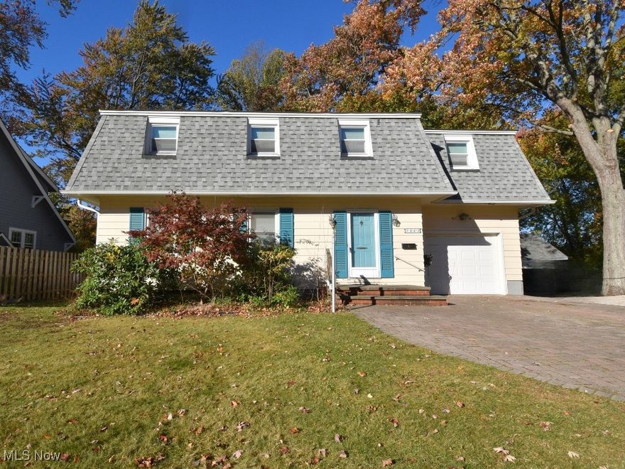 Welcome to this delightful, one owner 5 bed, 2.5 bath colonial-style home, superbly situated on a charming, quiet street in the heart of Mentor. Step through the front door and let the nostalgia take you back in time. The main level showcases a spacious living room that flows seamlessly into the dining room, offering a comfortable space for everyday living and hosting. Adjacent to the dining room, you will discover the most adorable kitchen that flows into a multi-purpose space, flexible enough to be fashioned into an additional dining area, a cozy sitting room, a drop zone or whatever your heart may desire. Rounding out the main level is a half bath. Upstairs, you will discover five spacious bedrooms and a full bath, along with a whole house fan which has the potential to provide significant benefits regarding energy savings. As we approach the colder months, take advantage of the warmth of the wood burning stove that is housed inside of the most beautiful and unique fireplace surround. Speaking of unique, don't forget to walk downstairs to the unfinished basement - a handyman's haven - which houses the laundry, a second full bath with jacuzzi and a workshop. Enjoy peaceful evenings in your backyard, relaxing on your patio or sitting around a fire, admiring your new home on one of the most sought after streets in the area. With its unique features and potential for customization, this home is ready to be transformed into your dream abode. Recent upgrades include a new roof, gutters, downspouts & gutter guards (2022). Seller is offering a one-year Home Warranty.