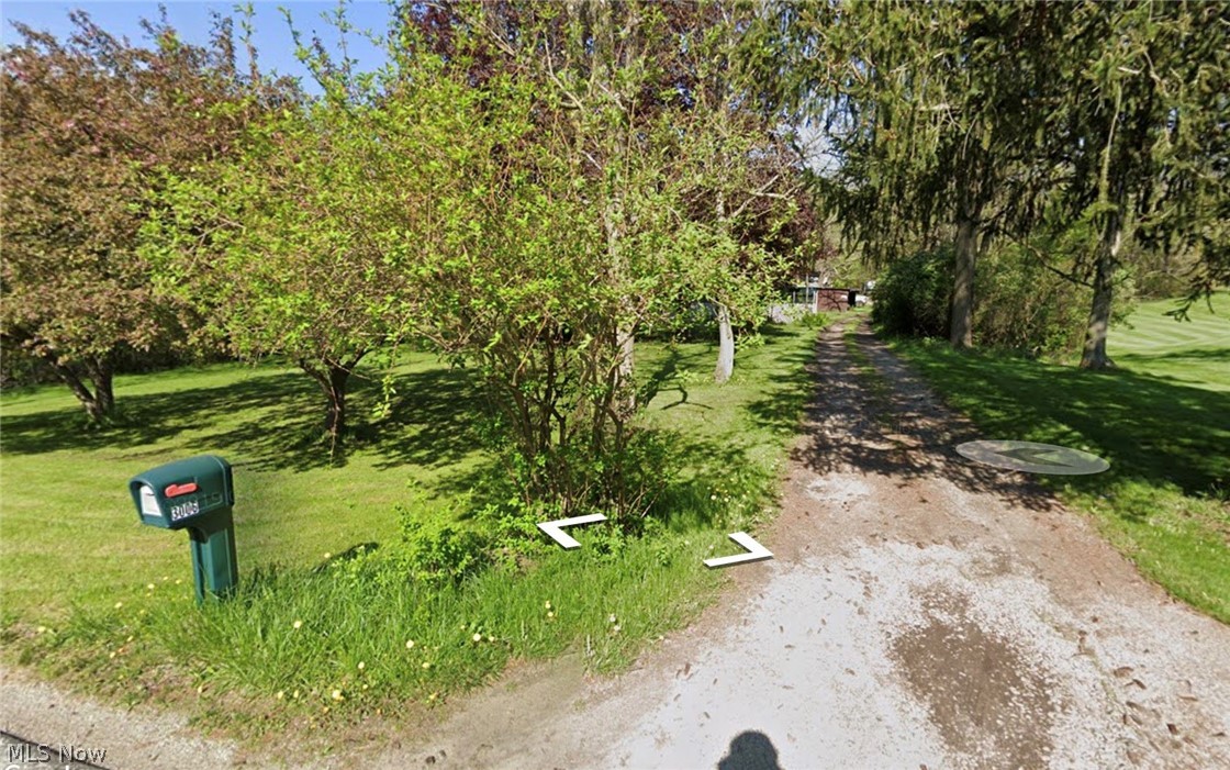 2.5 acres of residential property super close to Mogadore Reservoir. Property needs some work hauling away old trailer, shed & debris. Pole barn on property was used as livable space for several years. Feel free to drive by but do not enter/walk property as a tenant currently lives in trailer. Call directly to setup a private showing. Buyer is responsible for all due diligence in regard to zoning, natural resource rights, debris removal etc. Property being sold AS-IS.