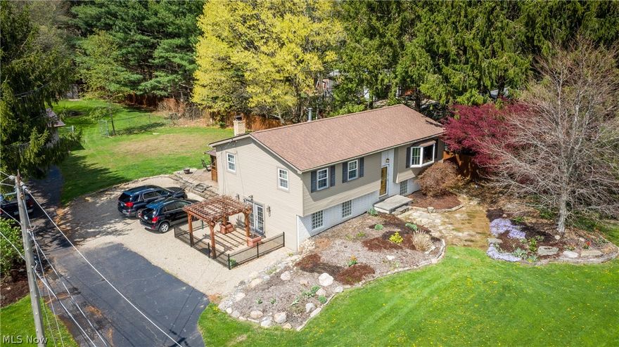 Wow! This home is a show stopper! The home sits on 1.57 acres, exterior features include a pond w/ fountain, fenced area, over sized two car garage, 16 X 12 gazebo w/ hot tub, spacious deck, & flagstone walkways. The inside of the home is set up to entertain or could be used as an in law suite. The main floor offers 3 bedrooms including master bedroom with walk in closet, beautiful updated eat in kitchen with plenty of cabinet space including a pantry, spacious living room with wood flooring & gorgeous bay window as well as an amazing tiled bathroom. The lower level offers a 4th bedroom, additional kitchen with butcher block counter top, full bath, & family room complete with pellet stove. This home is an entertainers dream. So many options from first floor kitchen which opens onto a spacious deck, the lower level kitchen with separate bar, or head all the way out back and have a picnic by the pond. You won't be disappointed in all the beautiful finishes throughout this home. This prop