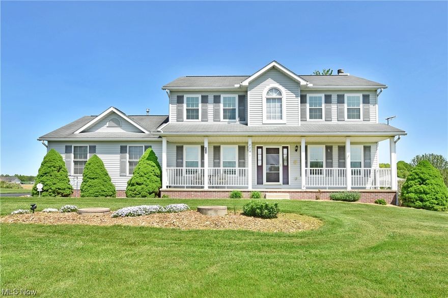 Find your countryside escape with this serene rural property paired with an impressive two-story home! The manicured property takes you past a tree lined driveway to find the towering home ready for the summer with its expansive, covered front patio. An arched window looks over the two-story foyer filling the floor below in natural light. A wooden staircase rises with its carpeted runner to find the upper living spaces nearby. At each side of the foyer, both a casual family room and carpeted formal dining room branch away, the latter highlighting its decadent hanging light and matching crown molding. The rear of the home opens to reveal an engaging open layout to include a fireplace shod living room and spacious casual dining. The updated kitchen boasts attractive tile work and marble countertops with additional bar top seating. A half bath and first floor laundry are located just steps away. A ravishing sunroom completes the first floor with its French doors and plush carpets. Upstair