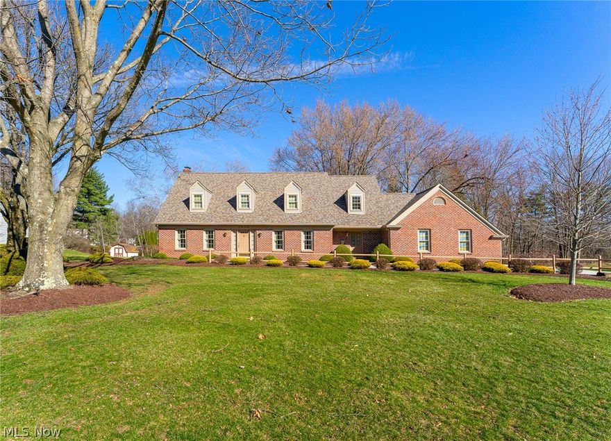 Nestled in on one of Canfield's premier cul-de-sac streets you'll find this stately cape cod shining brightly at the top of the street! Highly acclaimed Canfield School District! Pre-Inspected by an ASHI Home Inspector. This impeccably kept home radiates charm and character as you turn into the street, with it's most impressive front facade with multiple dormers and elegant brick entry. Situated on slightly under an acre, this 4-bedroom, 3 bath cape boasts random plank maple floors and six-panel Masonite doors throughout. Large living and dining rooms, through to an open kitchen with ceramic flooring, custom cherry cabinetry with breakfast bar.  Main floor laundry area as well as a newer, 4-season room in the back of the house with ceramic flooring and sliders out to a wrap-around deck, overlooking a beautiful, treed back yard. First floor full bath with shower. The upper level boasts four bedrooms with a unique den off the master bedroom, 3 closets, as well as ensuite. Over-size 24 x 35, 3-car garage, and 8 x 12 shed. Front stoop redone, 3/2026, removing bricks, power-cleaned, reinstalled and pointed.

Roof: 2023, Heating (Rheem 90%) & A/C: 2019, H/W Tank: 2019, Stove: 2020, Windows: 2016, Chimney rebuilt: 2000, Shrubs: 2005, Waterproofing, KRONN 2023 (Very clean job.) Landscaping: 2005.