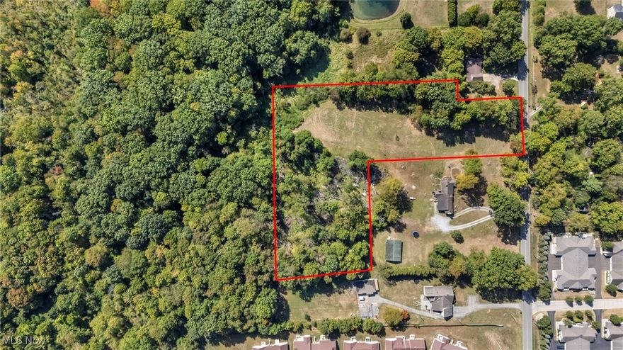 Build your dream home on 4.25 beautiful acres in Boardman Schools. This property offers the ideal setup: a wide, level clearing at the front—perfect for creating a long, impressive driveway—with a private wooded backdrop that makes the entire lot feel like your own peaceful retreat. The land is mostly flat and easy to build on, giving you flexibility for a ranch, a larger custom home, or a tucked-away design set deeper into the property. Public water, public sewer, and natural gas are available at the street, making the building process even smoother. You get privacy, space, and nature while still being just minutes from Rt. 224, I-680, parks, restaurants, shopping, and everything Boardman has to offer. If you’ve been waiting for the right piece of land—something beautiful, usable, and in an unbeatable location—this is the one.