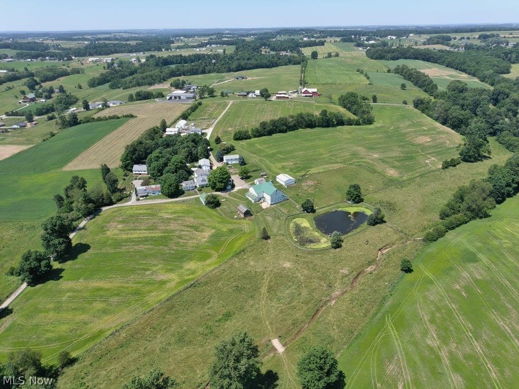 Located just outside Fredericksburg in the heart of Amish country, what was once known as The Yoder Bargain Store, this property offers an incredible opportunity to build your dream home or invest in a beautiful and productive farmstead. With road frontage along both Frease Rd. and Salt Creek Rd, these 79 acres in 12 parcels offers a diverse selection of rolling mostly open cropland along with a good mix of mature trees on several parcels. The heart of the original farm, offers 2 homes, a bank barn, and numerous outbuildings. The main house features 7 bedrooms and one bathroom and the smaller attached home has 3 bedrooms. The buildings that were once used as a retail store offer a potential for a variety of uses. Several warehouses are newer buildings that would give opportunity for a home-based business. These homes have free gas from an existing well. The older bank-barn has 11 stalls and features lots of space for your hay storage and animals. A 36x48 machinery shed that is in good