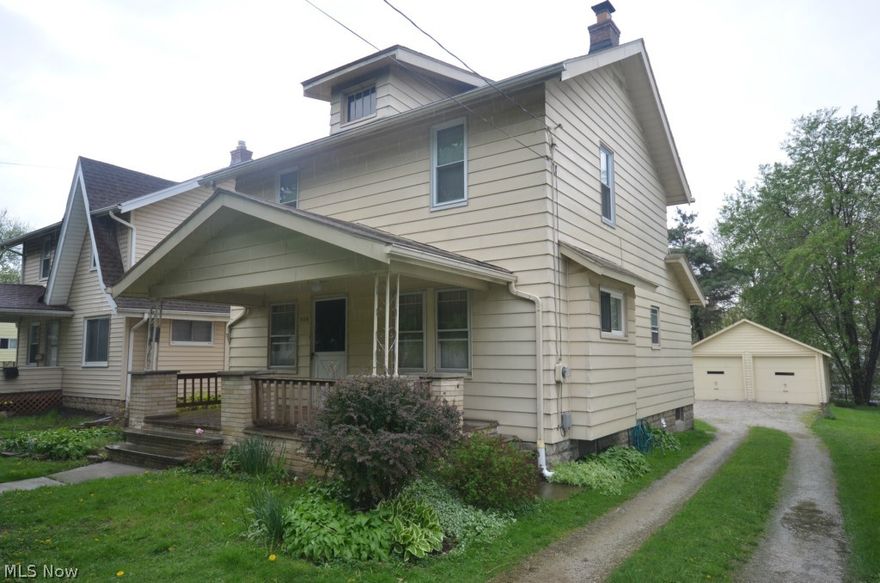 Incredible value! Spacious home w big two car garage and gorgeous original woodwork. Large covered front patio w updated floor and banister. Patio out back and nice yard space. Rare mud room entry at the back of the home to kick off shoes before coming in. Eat in kitchen w tile floors and back splash, nice cabinet space and dinette. Formal dining room w hardwood floors open to the living area. The living rm is large and inviting w a tile raised hearth fireplace w mantle and sconce lighting. Big full bath upstairs w updated surround and refinished tub. Gorgeous original solid wood built-ins found in the hall. 2nd floor features updated vinyl dual pane double hung windows too! Basement waterproofed by Ohio State Waterproofing complete w E-Z Breathe system. Updated hot water tank and electric on breakers. New sewer line from main soil stack to the street.