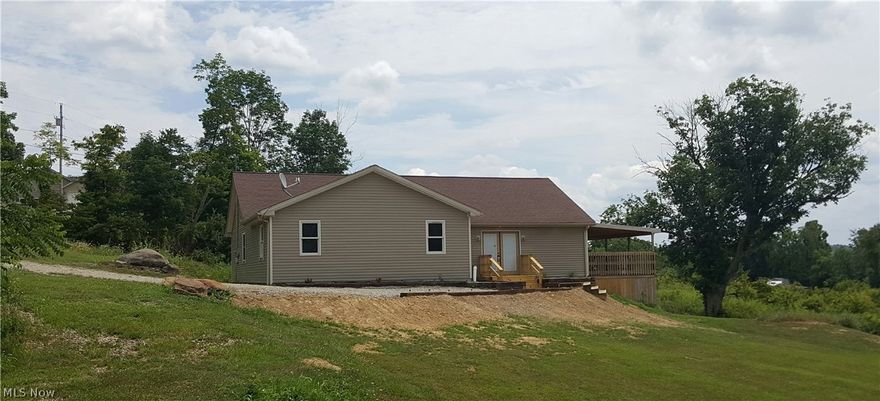 Newly built home in the country! This home offers 3 bedrooms and 2 full baths along with an open floor plan and one level living. There is plenty of closet space with walk in closets in every room. Enjoy the beautiful yard and wooded acreage from the huge deck. Located under 10 miles from I-77 and I-70, and on a paved state route, this home gives you the privacy of the country but easy to get to wherever you need to go. Call today for details.