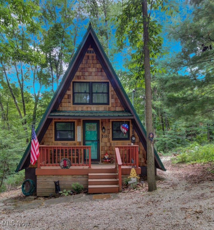 Adorable, Charming and Cozy A-Frame at Leesville Lake! Be the next owner of this cabin in the woods on 1.06 acre of private owned land! No lease fees! Leave your worries behind and relax! Nestled in a pretty wooded setting with seasonal lake views. Partially furnished and ready for you to bring your own personal touches! Enjoy some of the best Muskie fishing around on 1000 acres of this beautiful lake! New Metal Roof, Gutters with leaf guard in 2019. New Pex plumbing in 2019. Newer shaker shingles on the front of the house, all newer windows in the cabin, newer LVT flooring in kitchen and bath, and newer canopy garage to protect your "lake toys" from the weather! Walk out basement would be very easy to finish for additional living space if needed. Very efficient to own. Forced air heat along with free standing wood burner plumbed into duct work with central air. Enjoy year round get-aways! Electric bills run from $55 in the winter to $115-145 in the summer. Sunmar Centrex 2000 Central/External Composting Septic. Frontier DSL Internet. 7 wooded parcels. Large 14x20 wood deck offers seasonal lake views. Pontoon boat included with acceptable offer!