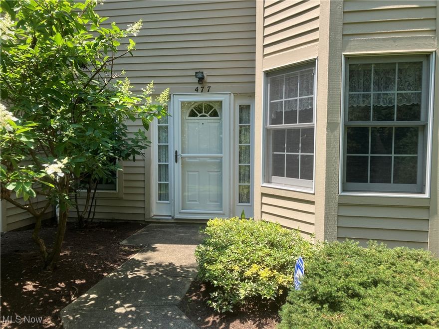 The open-concept living area features a bright and airy living room with a gas fireplace and ample natural light.  A french door leads to a private patio and backyard area, ideal for relaxing or entertaining. The kitchen offers plenty of storage and a view of the living area. Off the main living space, you'll find the main bedroom, includes a walk-in closet and access to the ensuite bathroom with double sinks, a soaking tub and separate shower. The second bedroom is located off of the main hallway as well. which could easily serve as a home office or bonus room, offering versatility for your needs. There is another full bathroom, located in the main hallway. The in-unit laundry room adds to the convenience. The Woodhawk community enhances your living experience with a gated entrance, providing privacy and security. Enjoy amenities including a pool, tennis courts, and well-maintained common areas for relaxation and recreation. With all of these incredible features, this condo offers a rare opportunity for comfortable, stylish, and convenient living in one of the area's most sought-after communities. Make this home yours today!