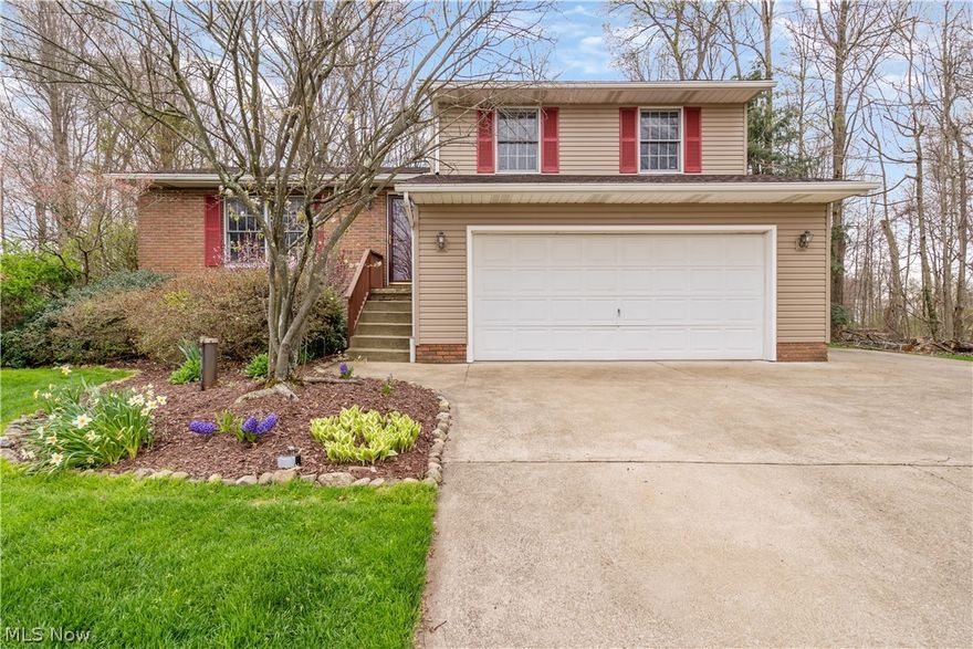 Come check out this fantastic move-in-ready four-level split in Plain LSD! Boasting over 2000 sq ft, this home features 3 bedrooms, 2.5 baths, and a walk-out lower level! The large paved driveway takes you to the two-car attached garage, plus there is additional space on the driveway for an extra vehicle. The open concept living room gives you easy access to the kitchen and dining room. The dining room features beautiful wood flooring and a large window. Right next door is the lovely kitchen. You'll find epoxy counters, tile backsplash, and stainless steel appliances (2019). Upstairs you'll find three bedrooms that are all carpeted and have ample closet space! The gorgeous fully updated full bath features a double vanity with granite counters, a stone surround, and cabinet space below. Plus a wonderful skylight. The lower level is fantastic! As we step down, you are met with the updated 1/2 bath that has linoleum flooring and single vanity with a stone surround. The family room is plen