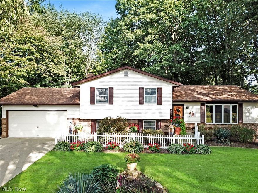 WOW! This 3 bedroom, 2.5 bedroom home has been meticulously cared for and it shows. As you enter the front door you are greated into the foyer. To the right is the living area or it can be used as a large dining area for entertaining. The kitchen cabinets have been professionally painted with corain countertops and updated stainless appliance. In the upper level is 3 bedrooms and a full bathroom. Down to the lower level in the family room is a wood burning fireplace to keep you cozy on those cold winter nights. The lower level is complete with a laundry room, a 1/2 bath and access to the garage. In the basement is a large walk in closet, another family rorom, office or turn this area into the master suite complete with a full bathroom. The whole house had new windows installed Oct. 2020. The large back deck is kept private by the surrounding trees with a fire pit area. There are 2 outdoor sheds for storage or hobbies. This home is close to all the amenities of Orrville. This one will n