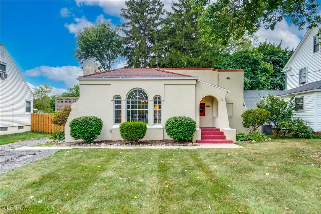 Welcome to 1224 Chestnut Ave., a beautifully updated Mediterranean-style ranch that perfectly blends timeless charm with modern upgrades. Bright, spacious rooms, gleaming hardwood floors, and distinctive Spanish-style windows fill this home with warmth and natural light.
The inviting living room boasts natural light, from the stunning ceiling to floor Spanish style fan window, and a cozy fireplace—an ideal space for gathering or relaxing. A large formal dining room is perfect for entertaining and flows seamlessly into the cheerful sunroom, where you’ll love sipping your morning coffee. The kitchen offers plentiful cabinetry and a functional layout ready for your culinary creativity.
Both bathrooms shine— the main bath was completely gutted and remodeled, with soaker tub, while a brand-new full bathroom with walk-in shower was added in the basement in 2023. Hardwood and ceramic tile floors with style and durability throughout much of the home.
This homes sits in a peaceful well maintained neighborhood, close to walking distance to Downtown Cuyahoga Falls. Loaded with restaurants, walking trail by the river, local businesses, and entertainment.