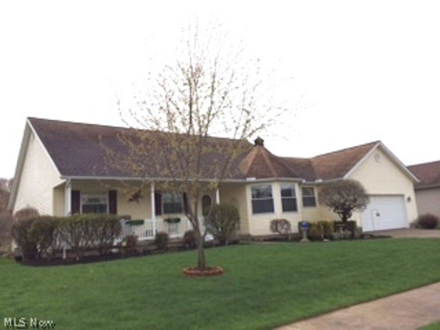 Attractive ranch home with a cozy front porch on a quiet street. Freshly painted interior walls, 3844 square ft. 4 bedrooms, 2 baths on the first floor, 2 car attached  garage, 1st floor laundry, office space. Spacious and open oak  kitchen - circular cathedral ceiling eating area,  large pantry and double sinks. A gas fireplace located  in the family room, which also has  vaulted ceilings and sliding glass doors leading  to the concrete patio  .  Large master bedroom suite boasts of a  private bath and walk- in closet. The lower level is great for entertaining for over night guests or  parties with its own kitchenette or  its own apartment-like living. A full bath, 2 bedrooms, office/craft room, 2 living areas. Wonderful outdoor space. Great curb appeal. This home is close to the grade school, interstate and shopping.  Definitely not Ordinary. Gas $68/mo, water $60/mo, and electric $140/mo.