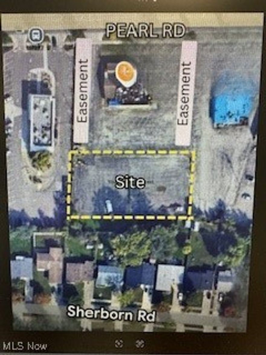 Prime Rear-Lot Commercial Opportunity
This 0.73-acre vacant commercial parcel (Parcel #472-26-010) sits directly behind 6405 Pearl Rd, placing it steps from one of Parma Heights busiest retail and restaurant corridors without paying Pearl Rd frontage pricing. This is a rare chance to secure an affordable infill development site in a proven commercial area with strong daily traffic, surrounding rooftops, and established businesses.
What makes this site special is functionality. The property benefits from two recorded access easements, one on each side of the front building providing practical ingress/egress to the rear parcel making this an ideal place for  a savvy buyer who understands commercial development and utility coordination. The lot measures approximately 183 x 124 (31,855 SF), offering flexibility for a range of commercial concepts. Under Parma Heights commercial zoning (Class C buyer to verify), permitted uses typically include professional or medical office, clinic, fitness studio, service retail, contractor office, showroom, commissary/ghost kitchen, or small business headquarters, while excluding heavy or nuisance uses. Typical commercial setbacks in Parma Heights allow buyers to envision a new construction footprint of roughly 8,00014,000 SF single-story, or larger with a multi-story design, subject to final site plan approval, parking, and stormwater requirements. This is a hidden-gem development site: Pearl Rd adjacency, dual easement access, and strong surrounding commercial energy perfect for an owner-user or developer looking to create value in a high-demand corridor at a compelling land basis