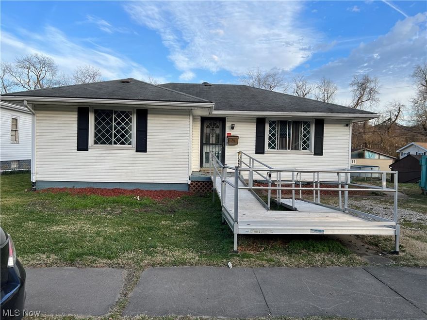 A ranch fixer-upper with 2 bedrooms & living rm. with hardwood floors. A separate dining area from the kitchen & full bath. Laundry area & garage in the basement.