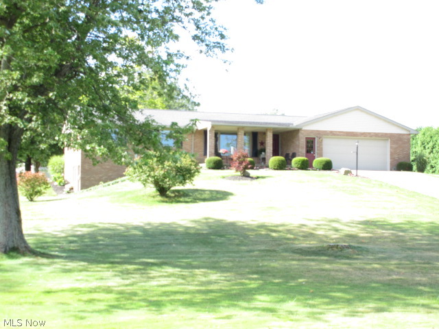 Refreshing Country Living On 1.67 Acres. Relax on The Covered Front Porch and Enjoy The Views, Immaculate Home Offers 1st Floor Family Room With Woodburning Fireplace and Doors Leading Out To Deck, Nice Kitchen and Dining Area, Formal Living Room, 1/2 Bath For Quests, Waterproofed Walk Out Lower Level, and For The Guys A Really Nice Pole Barn.