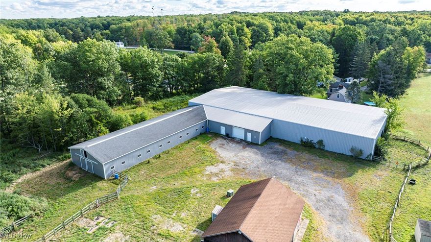 Equine Facility on 17+ Prime Acres! Your opportunity of a lifetime is waiting for you with 20 fully matted stalls, wash rack with hot water, viewing and tack rooms, separate feed, sawdust, and storage rooms. Hay loft with indoor stair access can store 500+ bales. Amish built 180 x 80 indoor riding arena with lifetime metal sided and roofed built in 2004. Outdoor arena 180 x 80 and fenced 4+ acre pasture with run in and pond, plenty of trailer parking and access to water. Bonus block building on site that has space for all the equipment and 600+ sq foot additional viewing/living area with a fireplace. 1 full and 1 half bath, and full kitchen potential. Behind facility there are 10+private park-like acres with running stream and trail rides or build your dream home! Upgrades include (2) hot water tanks, bathroom remodel, plumbing, fencing, security system, high speed internet, surround sound, lighting, and arena footing. This property has all the income potential to build a boarding or therapeutic riding facility while living your horse owning dreams. All this is conveniently located less than 2 minutes from I-90 ideal for boarding or training clients. Call today to see this amazing property and make your dreams come true!