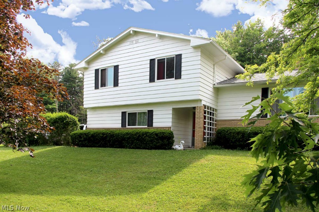 Outstanding location! Idyllic 4 Bedroom 2 1/2 Bathrooms setting on 1.37 acres in Bath township. Beautiful views from the top of the hill all year long. New Carpet 2015, New paint 2015 all living areas, Newly refinished hardwood floors 2015, New floors in all three baths 2015. New roof 2011, exterior painted 2011, New windows 2012 . Septic serviced and pumped 2013. Enjoy the covered patio off the family room with wild life abounding. Large living room with expansive window looking over the Cuyahoga River Valley. Eat in Kitchen opens to formal dinning area. The upper level features 4 Spacious bedrooms including Master suite with its own bathroom. Minutes from Hale Farm and Cuyahoga Valley National Park. Kitchens and Baths could use some updating. This is your opportunity to make this house your own at a reasonable price. Call today for your a private viewing.