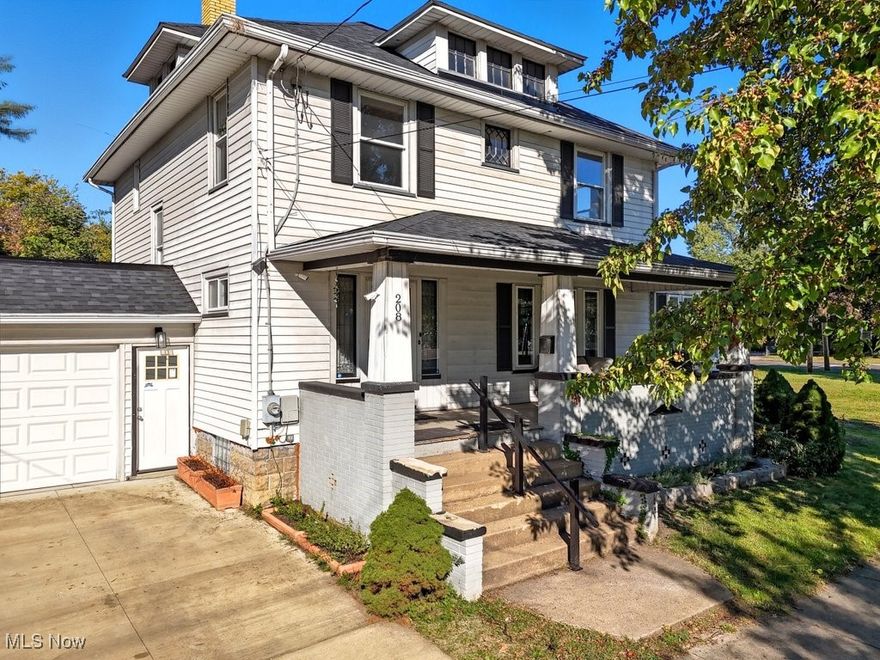 Offering 1,862 sq. ft. of living space, this beautifully updated home features 3 bedrooms, 1 full bath, and 2 half baths on over half an acre. Inside you will appreciate the original woodworking, charming built-ins, and gleaming refinished hardwood floors that showcase the character of this home. The spacious kitchen is a true showpiece with heavy-duty steel cabinets, stainless steel countertops, and brand-new stainless appliances. Gather in the large formal dining room, complete with original wainscoting and a built-in bar, that flows seamlessly into the living room featuring a cozy fireplace. A bright sunroom off the living room provides versatile space for an office or reading nook. Highlights include: convenient 1st-floor laundry, 1-car attached garage, large covered front porch and rear concrete patio for outdoor living, full basement & walk-up attic offering ample storage, Dual-zone central air, updated electrical panel, and new plumbing in areas, restored full bath with cast iron tub, subway tile surround, matte black fixtures & new vanities, newer lighting, windows, and more throughout. An added bonus is the extra parcel zoned commercial, opening the door to possibilities for an investment opportunity. This home perfectly blends modern updates with timeless character don’t miss your chance to own this Ravenna gem!