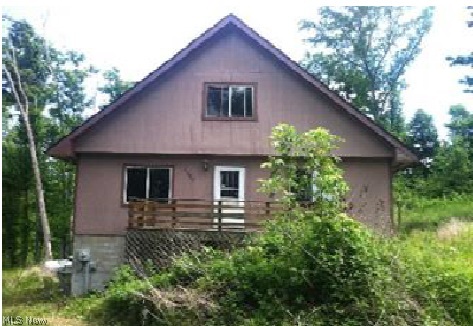 Cute fixer-upper, 2 bedroom 1 bath cape cod styled home rurally located on a 2.5 acre wooded, sloping lot. This home offers 1,792 s.f. of living space with a galley style kitchen, hard wood floors, ceiling fans, and a full basement. This home also features a deck. Bring your sweat and build some equity. REO Property, Sold AS-IS W/O Repair, Warranty or Seller Disclosure. The Listing Broker & Seller assume no responsibility & make no guarantees, warranties or representations as to the availability or accuracy of information contained herein. Buyer or buyer's agent responsible for confirmation of information contained herein. Water activation not permitted, only air pressure test. Effective tax rate has not been verified; please contact the local county tax authority for accurate tax rate.