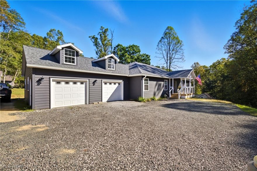 Built in 2024, this 2,700 sq. ft. home sits on two lots totaling 1.6 acres. The open floor plan features 3 bedrooms, 3 full baths (two with walk-in showers), an office, and a living, dining, and kitchen area with upgraded Samsung appliances including a deluxe refrigerator. The primary suite includes dual walk-in closets and slider access to the covered back patio, also accessible from the dining and living rooms. The oversized 30’ x 30’ attached garage provides excellent storage, while the walkout basement offers an additional attached garage, plumbing for a future bath, a framed fireplace, and one room already sectioned off—perfect for expansion.