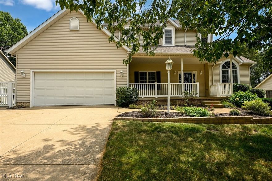 Location! Location! Location! Nestled within the Robins Trace development and Green Local Schools, this 4 bedroom 2.5 bath home offers a popular and well loved floor plan. Upon arrival at the home a 23x10 covered front porch greets you. A perfect place for a cup of morning coffee! Entering the home the large foyer features hardwood flooring that extends into the vaulted living room/office and dining room. The eat-in kitchen has been updated with 42" cabinetry, granite counters and a beautiful backsplash. The bay window provides plenty of natural light and looks over the backyard. Sliding glass doors lead to an oversized (26x19) deck with a vinyl fenced backyard. Beautiful windows and a gas fireplace are in the vaulted family room adjacent to the kitchen and makes the area perfect for entertaining family and friends. The second floor houses the Owners Suite with a large walk-in closet and attached Owners bath with double sinks, a soaking tub and separate shower. Three additional bedrooms and a main bath complete the second floor. The lower level provides additional living space with a partially finished basement with an egress window for added lighting and safety plus plumbing for another bath. There is an abundance of storage as well with shelving and a small workshop area. Conveniently located near the shopping district and restaurants with great freeway access, this home checks all the boxes!
