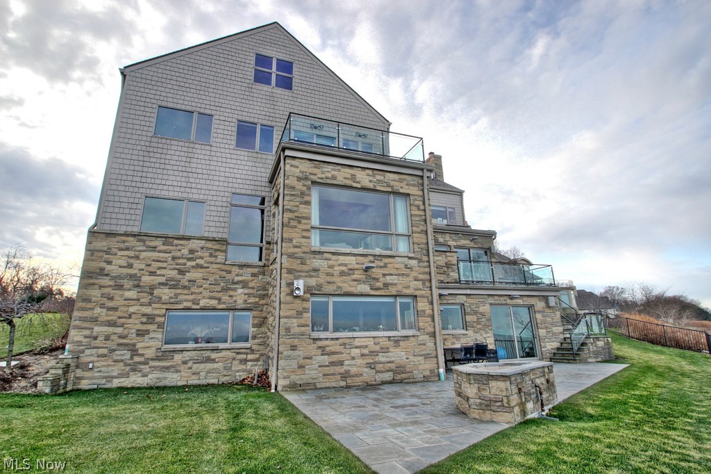Introducing this innovative masterpiece designed by one of Cleveland's most famous architects- Piet Van Dijk! Energy efficient and flawlessly maintained modern day SMART HOME overlooks Lake Erie! 4 bedrooms plus an incredible nanny suite. Stunning designed chef's kitchen with Poggen Phol cabinets and top-of-the-line appliances including, Miele, SubZero, Fisher and Paykel. Open living areas surrounded by floor to ceiling windows with the most fascinating waterfront views. The walk-out lower level is an entertainer's dream- with a movie theatre, full kitchen, recessed salt water tank, and so much more! Words cannot describe this MAGNIFICENT home! Upscale gated community located just minutes from shopping, restaurants, downtown night-life, CWRU, University Hospitals, Cleveland Clinic, CSU, Little Italy, and more!