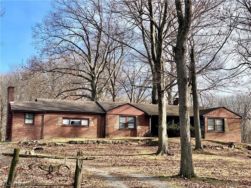 Amazing opportunity awaits, 2400SQFT home on 6 acres with a generous amount of road frontage in a premium location just off Western Reserve Rd., 4 Bedrooms, 2 Full Baths, full basement, nice quality construction, 2 stone fireplaces, hardwood floors, plaster walls, etc, Barn , Seller will escrow funds to tie into the public sewer with an acceptable offer. House currently on well water. city water at street,  a ton of potential, if you have been desiring home with acreage in a great location and not afraid of some work this is it,