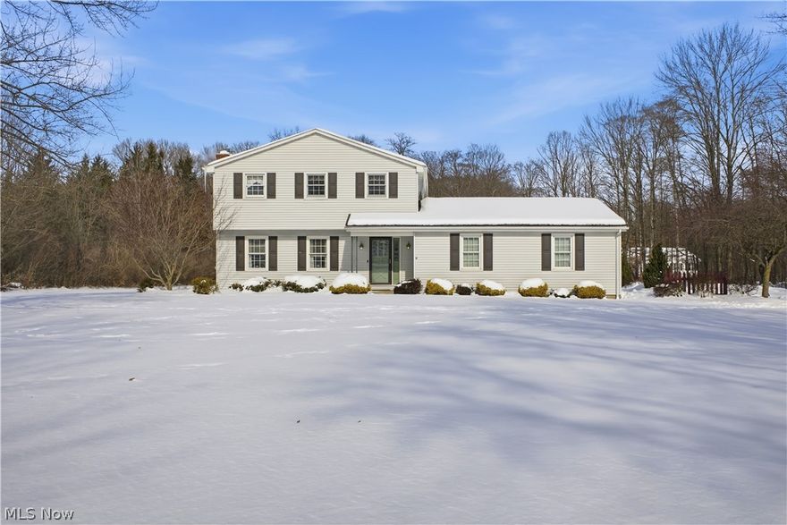 Home Sweet Country Home on 1.5 Acres awaits in this beautifully maintained 3 bedroom, 2 bath home in the desirable South Range School District. The inviting living room features a cozy gas fireplace framed by built in bookcases, creating the perfect gathering space. The kitchen and comes equipped with a stove, refrigerator, dishwasher,  and convenient side bar area, perfect for entertaining. The attached  dinette, with a picture window overlooks the beautiful backyard. Enjoy additional views from with the bright family room with a wall of windows and electric baseboard heat. A convenient full bath with step in shower completes the 1st floor.
Upstairs you’ll find a spacious primary bedroom with crown molding and double closets, along with two additional bedrooms, each with double closets. The second full bath includes a tub and shower combo, double sinks, and a linen closet. The full basement features glass block windows, while the attached two garage with Nature Stone flooring is heated, has a 220 line, and offers both hot and cold water. Outside there is a 20x20 cement patio and an additional one car detached garage that provides extra storage. There is room to roam on the beautiful 1.5 acre lot. Major updates include a roof in 2016, hot water tank in 2020, The home is wired for a portable generator. If you are looking for a house that feels like home from the very first step inside, this is the home you have been waiting for. Call to make this your home sweet country home today! Ring door bell camera does not stay.