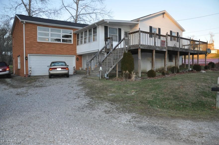 Lots of updates since 2006: new windows and trim basement level; new electric heat pump and central air; new roof shingles, gutters and downspouts; new garage door; new carpet, ceramic tile and flooring; new kitchen counter tops and appliances; new surround tub and ceramic tile first floor bath; new sink and ceramic tile lower level bath; new deck; new septic and leach system; new wood burner add on for furnace (used to heat the home more than electric heat pump). This raised ranch home offers 1700+ S.F. of living space including first floor family room with fireplace, entry foyer, sunporch, updated kitchen, dining area open to living room, three bedrooms and full bathroom. Wood floors under most carpet.  Lower level offers ceramic tile in part of basement, commode, shower and sink, large room used for workshop could be finished for additional living area, and laundry room.  Six lots makes up approx. 1.2 acres, including parcel no. 20-15-17-08-000. Call today for your showing appointme