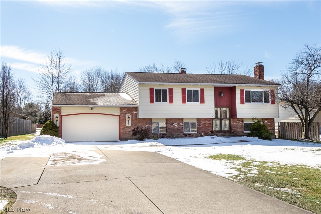 A hidden gem in Macedonia, this delightful bi-level home has been fully renovated and is move-in-ready! Inside you are greeted by new flooring throughout, fresh neutral paint in every room, quartz countertops, and stainless steel appliances. The lower level has also been fully finished with a newly added bedroom and full bath. Going up the entry stairs you are welcomed by a large open living space with a bright three-pane picture window. The dining space opens to the kitchen and has sliding doors to a spacious deck that overlooks the backyard. The kitchen has a breakfast bar, a new stainless steel fridge, range, dishwasher and an extra large sink. On the main floor there are three bedrooms with plenty of closet space. Off the main bedroom is a personal powder room with brand new fixtures. There is also a full bathroom on the main floor that has a shower/tub combo. On the lower level you’ll find a large family room with a brick fireplace and french doors that lead to the fully fenced in