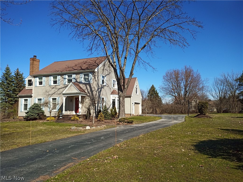 Kensington Green, one of the most desirable neighborhoods in desirable Chagrin Falls SD. An expansive oval green w/walking trails & cul-de-sac streets. This exceptional home offers hdwd floors & attention to detail throughout. Family room w/fireplace & great views. Cook's kitchen w/granite & custom cherry cabinets w/beautiful views & opens to large dining room w/bay window view of the green. Guest suite w/private stairway, fireplace & built-in bookshelves w/refrigerator &wet bar. Master suite w/vaulted ceilings & adjoining bath remodeled in 2016. Two addl bdrms share remodeled bath in 2015. Finished LL w/theater room w/wet bar, office & storage. Newly painted. H2O heater Feb. 2019, kitchen refrigerator March 2020, furnace 2009, new shrubbery & 35 yr. roof in 2006.Truly a MUST SEE!