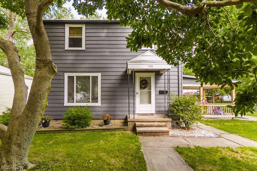 One of the largest yards you'll find in the area! Nestled on a fenced 120x135 lot, you'll love having the oversized yard for outdoor fun. Nicely updated home with neutral paint and hardwood floors in most rooms! Beautifully updated kitchen with many added extras such as crown molding, glass front accent cupboards, built in shelving, pull out pantry and appliances stay! Dining & living rooms have hardwood flooring.  Walk up attic for storage. Full basement has half bath. Backyard offers huge covered porch plus a deck and a 2 car garage PLUS a huge oversized shed! (Lot consists of three deeded 40x135 parcels). Located just blocks from West Recreation Center and Park!