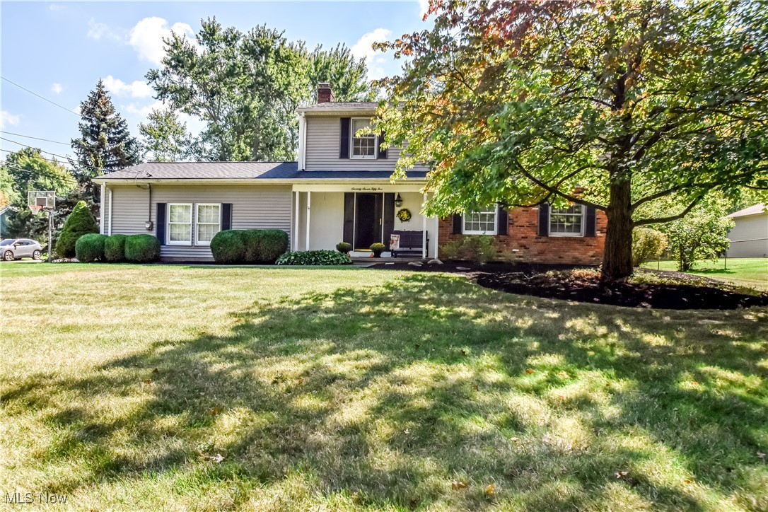 Step into this beautifully cared for four bedroom, 2.5 bath center hall colonial offering timeless charm and a welcoming layout. Perfectly situated on Chillicothe Road with driveway access off quiet Fairhaven Court, this home combines convenience with peace of mind. The cul-de-sac entry makes it easy to get on and off the main road, while the majority of the property extends into the private backyard on Fairhaven—giving you the comfort of a neighborhood setting without the worry of traffic. Inside, you’ll be greeted by a spacious foyer that sets the tone for the traditional center hall design. The generously sized living and dining room combination is ideal for hosting family gatherings and holidays. A cozy family room with a wood-burning fireplace provides a perfect retreat on cooler evenings and opens through a sliding glass door to a newly constructed stamped concrete patio with fire pit, surrounded by mature trees for a private, wooded backdrop. Upstairs, you’ll find four generously sized bedrooms, including a primary suite with attached en suite bath. Two of the secondary bedrooms feature full walls of closet space, ensuring ample storage. The unfinished basement offers unlimited potential—whether you envision a game room, hobby space, fitness area, or teen hangout, it’s a blank canvas ready for your ideas. Additional highlights include a two-car attached garage, abundant storage throughout, and an unbeatable location in Mentor—close to schools, shopping, and community amenities. This home has been immaculately cared for and is ready for its next owner to create lasting memories. Don’t miss this opportunity to own in one of Mentor’s most desired neighborhoods. Schedule your private showing today before it’s gone!