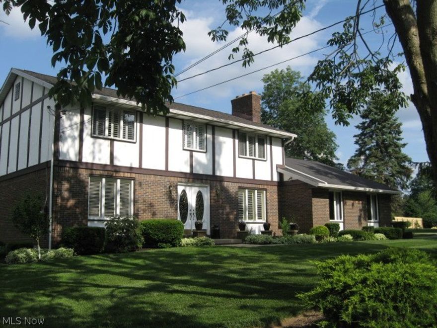 ABSOLUTELY SPOTLESS! BEAUTIFUL 4 BEDROOM, 2.5 BATHS TWO STORY TUDOR w/2460 sq ft + LOWER LEVEL 837 sq ft = 3297 TOTAL sq ft ON QUIET CORNER. PRIDE OF OWNERSHIP DEFINITELY SHOWS ON THIS ALMOST ACRE LOT. GORGEOUS LANDSCAPING! BRICK PAVER WALKWAY LEADS TO PEACEFUL & TRANQUIL OASIS. ADDING TO THIS PLEASANT EXPERIENCE IS A "COY" POND w/WATERFALL. EAT IN KITCHEN - STAINLESS APPLIANCES, NEW COUNTERTOPS, SINK, WINE RACK & HARDWOOD FLOORING. FOUR KITCHEN BAR STOOLS. REVERSE OSMOSIS - KITCHEN SINK & ICE MAKER. FIRST FLOOR LAUNDRY. DINING ROOM - NEW CHANDELIER, CROWN MOLDING & CHAIR RAIL. LIVING ROOM - CROWN MOLDING. FAMILY ROOM & MASTER BEDROOM - BOTH HAVE GAS LOG FIREPLACES VENT FREE. 2ND FLOOR MASTER BEDROOM - CEILING FAN & WALK IN CLOSET. ALL 3 BATHROOMS HAVE BEEN COMPLETELY REDONE w/NEW FIXTURES, VANITIES & FLOORING. MAIN BATH 2ND FLOOR HAS A SKY LIGHT. PLANTATION SHUTTERS ON MOST WINDOWS. LOWER LEVEL - RECREATION ROOM. BAR AREA - FRIDGE w/TAP & 4 BAR STOOLS. CRAFT ROOM - w/BUILT IN TABLE (Q