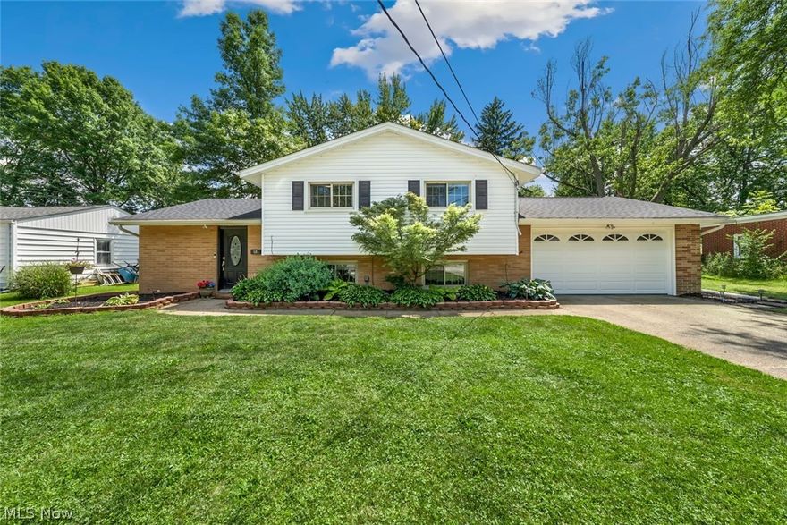 This meticulously renovated Split Level home boasts modern charm and inviting ambiance. As you approach the house, you'll be captivated by its appealing curb appeal that warmly welcomes you home. Upon entering, prepare to be amazed by the spacious and open living room, adorned with a vaulted ceiling and stylish epoxy flooring. This floorpan allows you to effortlessly entertain guests or enjoy peaceful moments at home. The updated eat-in kitchen is a culinary delight, boasting a dining area, wood-wrapped columns and beam, a breakfast bar, and sprawling countertops. The beautiful backsplash and trendy two-tone, soft-close cabinetry add a touch of elegance and functionality to this space. Equipped with stainless appliances, meal preparation becomes a pleasure. Adjacent to the kitchen is a cozy media/theater room (currently used as a dining room) providing a comfortable retreat for leisure and entertainment. A conveniently updated full bath and utility/laundry room, complete with a washer and dryer, add to the seamless convenience of this home. The four generous bedrooms, all featuring rich refinished hardwood floors, offer a serene and private haven for rest and rejuvenation. The second full bath has been thoughtfully updated with modern fixtures and finishes, providing a spa-like experience. The oversized and heated two-car garage, featuring a slip-resistant floor, ensures convenience and comfort for homeowners. The thoughtfully landscaped backyard with a charming patio provides the perfect space to relax and unwind. To provide peace of mind, a one-year home warranty is included, offering reassurance and protection. Located on a quiet dead-end street with a trail entry to the MetroParks, this home offers a serene and convenient location for outdoor enthusiasts and nature lovers.