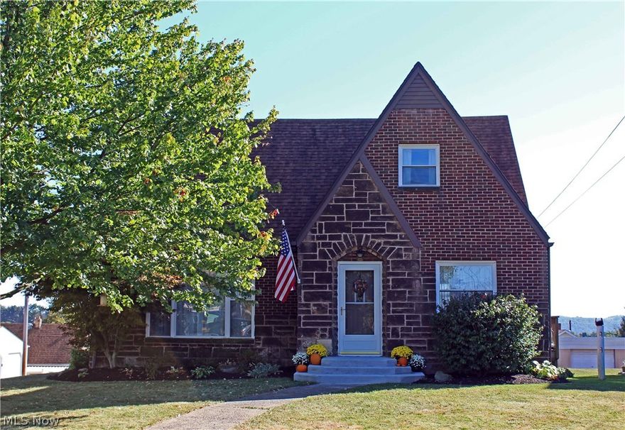 Don't miss your chance! Situated on a beautifully landscaped corner lot, this charming brick Cape Cod features 3 bedrooms and 1.5 baths plus a 2 car detached garage.  Hosting holidays will be a breeze in the large kitchen with stainless steel appliances and formal dining room.  Relax in the living room with new carpet and decorative fireplace.  First floor bedroom with new carpet and brand new half bath nearby.  Two large bedrooms upstairs with hardwood floors and brand new full bath.  Enjoy sitting out on the large deck and entertaining family and friends.  This home is move in ready and won't last long!