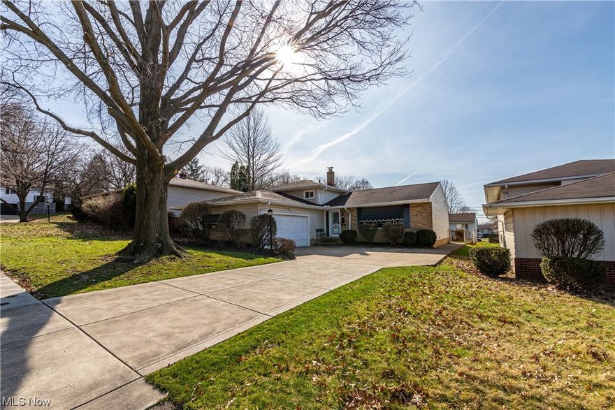 Welcome to this meticulous maintained and well loved split level in a quiet neighborhood in Garfield Heights.  As you enter the spacious entry, you are welcomed by a large living room with oversized picture window, the light and spacious dining room boosts access to the large patio and backyard which is fully fenced, perfect for entertaining on summer nights.  The oversized kitchen has plenty of cabinet storage, plenty of counter space and boosts an eat in area for family meals.  The home boosts three spacious bedrooms with hardwood floors and plenty of closet space and a full bathroom with double sinks on second floor. The lower level family room has a stone fireplace, built in book shelves and plenty of space for family movie night.  The second bath, laundry and storage are also on lower level.  Updates include new furnace, air conditioner, and hot water tank, newer vinyl windows.  Property is being sold AS-IS, seller would prefer to make no repairs.  Property will be POS compliant prior to transfer.