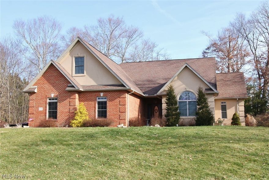 Beautiful custom built home in Maple Creek Subdivision. This brick home offers an open floor plan for entertaining or enjoying space with the family.The 2 story family room has a large gas fireplace and beautiful hardwood floors that flow through out the home.There is a glass sun room with a cathedral ceiling and tile flooring. The kitchen offers custom cherry cabinets,stainless steel appliances and a breakfast bar.The laundry room is right off the kitchen and near the man door to the garage.The large master bedroom is located on the first level and has French door leading into the very elegant master bath.The bathroom features double sinks,Whirlpool tub,walk-in-shower and linen closet.There are large custom cabinets in the master bath as well as a large walk in closet with built in cabinets.There is also an office with a half bath on the first level.The staircase to the upper and lower floors are made of wood and iron.The upper level has a large loft area with 2 double door closets fo