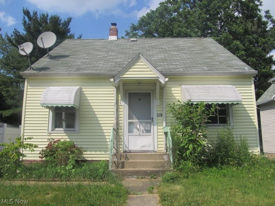 Three bedroom Barberton cape cod. Living Room w/ hardwood floors. First floor has 2 bedrooms and full bath. Upstairs has large attic bedroom. Full basement. Nice size lot w/ shed. SOLD AS IS - BANK OWNED.