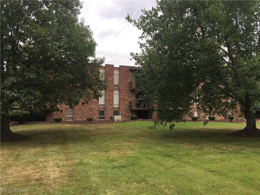 Immaculate Howland condo at Terrace North with beautiful custom woodwork! Updates included updated kitchen with custom Mission-style wood cabinets, matching moveable island and oak sable distressed hardwood floors. Huge living area with neutral carpet in mint condition. Large sliding door leading to private balcony with beautiful views of the trees and community POOL. Two spacious bedrooms. Master bedroom with HUGE closets, lots of natural light comes through the oversized window. Spare room has custom wood bookshelves and wooden closet doors with decorative leaded glass. Bathroom updates include custom made black vanity with Delta faucet.  Features covered parking and extra storage area. Condo fee includes everything but electric, even includes cable. Just move right in to this low-maintenance gem! Available immediately. Selling As-Is.