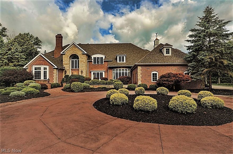 This magnificent Medina custom showplace is located on a private, 4+ acre cul-de-sac lot in beautiful Champion Creek , with two additional adjoining lots also available. Distinctive architecture and design are evident throughout this 7929 fin. sq. ft. home, featuring luxury appointments from top to bottom. The grand foyer features a dramatic curved staircase, with French doors opening to the handsome library, and formal living room, each featuring a fireplace. The expansive formal dining room is perfect for entertaining large groups or smaller intimate gatherings. while the gourmet chef's kitchen provides professional appliances, an enormous work island, and great lighting. The spacious family room, two solariums, and a fabulous first floor master suite, complete the main floor living spaces, along with a laundry room and powder rooms.  An additional master suite is located on the upper level, as well as four large bedrooms, each with its own en suite bathroom, and another large laundry room. Additionally, there is extensive walk-in storage and closet space.  The lower level features a large open family room, office space, a private exercise room, and loads of storage. Additional amenities include a 4 car heated garage, newer roof, circular drive, enormous patio and deck, and a storage shed.  9 total baths, 6 fireplaces, and spectacular views add to the enjoyment and value of this one-of-a-kind home, meticulously maintained and waiting for its new owners.