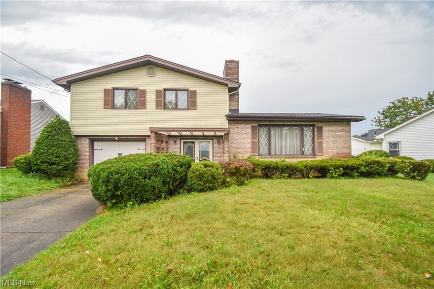 Nestled in the heart of Girard, this 4-level split home offers a unique blend of vintage character and untapped potential. With 3 bedrooms, 1.5 baths, a 1-car attached garage, and a patio, this property is ready to be made into a home. As you step inside, you will have plenty of space to hang your coats in the foyer and it has a cozy sitting room, that walks out to the back patio. Upstairs is the spacious living room,  kitchen and dining room with sliding glass doors to the backyard. Upstairs, you'll find three bedrooms and full bath. With plenty of opportunity to add your own personal style and increase equity, this property is great for someone looking to fix it while they live there. Whether you're a vintage enthusiast looking to preserve the past or a DIY connoisseur ready to create the home of your dreams, this Girard gem is your canvas.