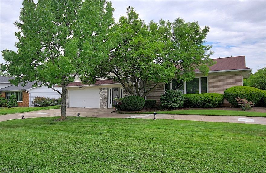 WOW!! Oversized Split in the Heart of Beachwood! So convenient to Beachwood Aquatic Center, Park and playground, Walking trails and even RTA. Dramatic Living Room with Cathedral beamed ceiling, wide plank dark stained Oak floors in LR/DR. L-shaped LR/DR floor plan for extending a table to accommodate numerous guests! Tremendous Kitchen with 2 skylights, Granite counters, center island, double ovens, gas cooktop, new (May 2018) stainless dishwasher, and oversized breakfast area with built ins, desk and storage, with French doors leading to deck!  Family Room, 21x18 with wall of built ins, fireplace, oak flooring, leads to paver patio! 17x7 Marble foyer! Ample util room on first and two access doors to garage! Second floor has tremendous closet space and storage, Master with two closets and partly updated bath, attic fan, hardwood under carpet and ample sized bedrooms with ceiling fans! LL: 28x14, carpeted, partly finished, newer furnace. Manicured yard with many mature plantings and a c