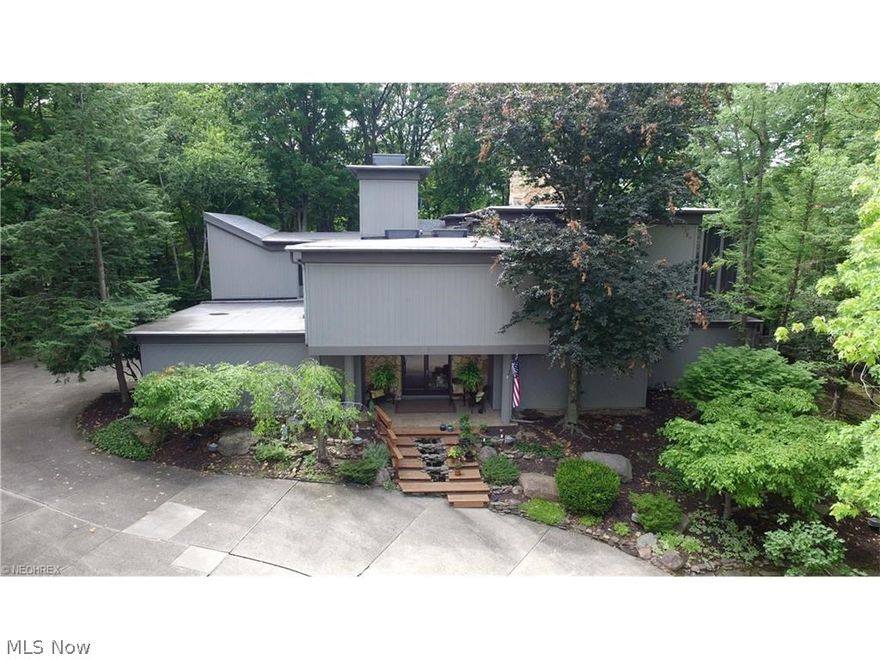 A touch of “Falling Water”. Inspired by Frank Lloyd Wright, Bob Schmitt created this one-of-a-kind home of distinction. This home is considered the Crown Jewel of Strongsville’s Ledgewood Development. Sitting atop of a Private Cul-de-sac overlooking breathtaking views of the Metroparks & the Rocky River, this awe-inspiring piece of architecture is truly a Showstopper. Featuring a unique one-of-a-kind floor plan. Walk in to immense foyer with a soaring stair case, ceilings & skylights. There are 5 bedrooms on the 1st level including a guest suite and master suite complete with a glamour bath with soaking tub, sauna, & breathtaking views. Also on the 1st level is a large laundry room for convenience and a 3 car side load garage. The 2nd floor boasts an eat-in kitchen with island, granite countertops, upgraded appliances, custom cabinets & a screened in outdoor breakfast nook with views to die for. An office with custom built ins to work from home and a large studio with skylights make li