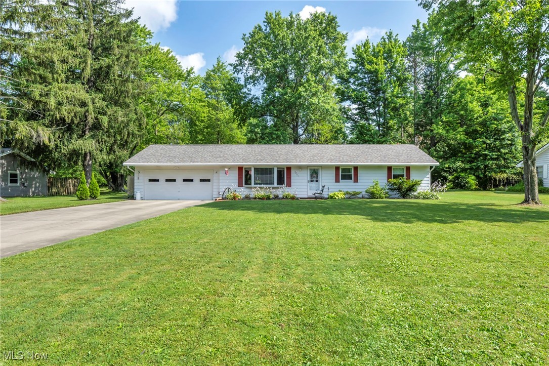 One-floor living at its finest in a highly sought-after North Hudson location! Tucked away on a quiet, no-outlet street, this well-cared-for & updated 3-bedroom, 1.5-bath ranch offers comfort, privacy, & convenience in one exceptional package. Home sits on a deep, beautifully landscaped lot with an updated, widened driveway plus an eye-catching brand-new dimensional roof, offering curb appeal & peace of mind for years to come. Enjoy your own private backyard retreat—fully fenced & lightly treed—storage shed, portable pool (easily removed if preferred), and a newer hot tub to soak your cares away year-round. Step inside through a premium front door into a naturally lit interior featuring updated windows & a spacious, flowing layout. Large great room is filled with warmth & charm, highlighted by a massive bay window & an included electric fireplace for cozy evenings. Kitchen will impress any cook with generous cabinet and counter space, updated appliances (all included), and a dining area perfect for larger gatherings. All three bedrooms are well-sized and conveniently located near the updated full and half baths. First-floor laundry room is complete with a sink and great workspace (new washer/dryer negotiable). Mechanically sound with a 6-year-old furnace, 3-year-old central air for year round comfort, gutter screens for easy upkeep, 3-year-old Culligan water softener plus reverse osmosis system at the kitchen sink. The attached oversized 2-car garage includes a nature stone floor coating for durability and a finished look. Immediate comfort, truly amazing yard, and a location that can’t be beat—don’t miss this rare affordable Hudson gem!