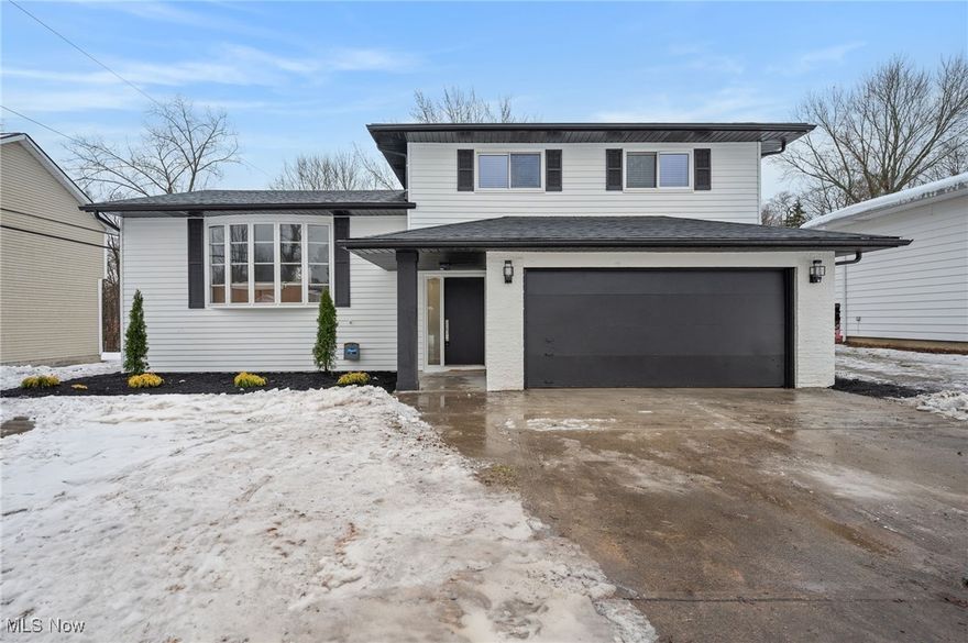 Welcome to 25970 Cambridge Drive, where the holiday lights are already up to welcome you home!  A stunning Coby Socher renovation and the perfect chance to turn your holiday wish into a dream come true. This home has been completely renovated inside and out—from the brand-new 2025 roof, landscaped and painted exterior, and high-end exterior lighting to an interior filled with all-new flooring and a full top to bottom redesign. The large living room flows into a dining area anchored by a statement chandelier, while the show stopping kitchen features soft-close cabinets, quartz counters with a waterfall bar, full backsplash walls, Samsung stainless appliances, an oversized sink with premium accessories, and a garbage disposal. A cozy family room with a fireplace opens to a covered porch, and a first-floor half bath adds convenience. Upstairs offers three spacious bedrooms, including a primary bedroom with two closets, plus a dream bathroom with full-wall tile and high-end fixtures. The finished basement provides a great rec room and a dedicated laundry space. With an immaculate presentation, a two-car attached garage, a huge backyard backing to woods, and a storage shed, this home checks every box in a charming and convenient neighborhood. Seller has already completed a general home inspection, available upon request. Agent is owner.