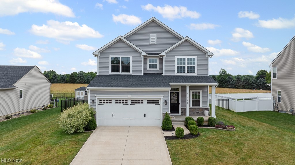 Welcome to this stunning Colonial-style home nestled in the desirable Cranberry Creek development in Brimfield Township, located within the Field Local School District. Offering 5 spacious bedrooms and 4 bathrooms, this home blends timeless charm with modern updates including all-new carpet throughout —perfect for growing families or those who love to entertain. Inside discover a light-filled open-concept first floor featuring a cozy living space and, of course, the heart of the home - a stylish kitchen, complete with white subway tile backsplash, granite countertops, ample cabinetry, a pantry, and a kitchen island ideal for casual meals or gatherings. A convenient powder room completes the main level. Upstairs, you'll find four generously sized bedrooms, including a luxurious owner's suite with a walk-in closet and a private full bath boasting dual vanities. For added convenience, the second-floor laundry closet makes household chores a breeze. The newly renovated basement is a true bonus space, featuring a large recreational room, a fifth bedroom with an egress window, and a full bathroom—perfect for guests or multi-generational living. Two separate storage rooms provide additional functionality. Enjoy the outdoors in your private backyard oasis, which backs up to a scenic open field. Relax on the back deck, gather around the fire pit, and appreciate the privacy of an elegant black aluminum fence with three separate gates for easy access and security. Don't miss your chance to own this move-in-ready home in a prime location. Schedule your private tour today and experience all that this beautiful home has to offer!